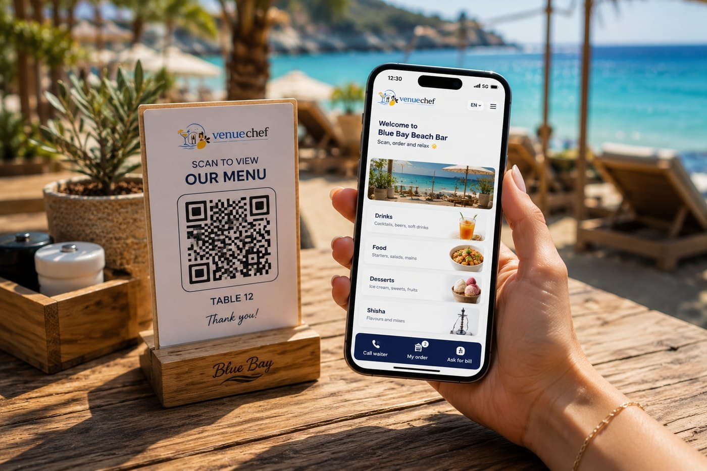 A guest holding a phone showing the VenueChef guest menu for Blue Bay Beach Bar, beside a table stand with the scan-to-view QR code for table 12